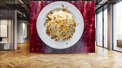 Chicken Kacchi Biryani or biriyani rice with fried onion served in plate isolated on table background top view of bangladeshi, indian and pakistani food Wall mural