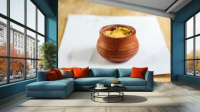 Firni, phirni anf kheer with nuts served in pot isolated on mat top view of indian, bangali and pakistani dessert mithai Wall mural