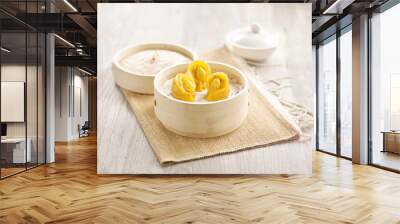 Steamed Chicken and Pig’s Stomach with White Pepper Dumpling served in a wooden bowl with chopsticks isolated on mat side view on grey marble background Wall mural