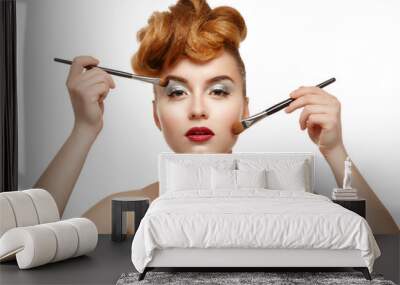 beauty portrait of pretty woman with brush for makeup Wall mural