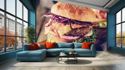 Delicious homemade hamburger on wooden background. Wall mural