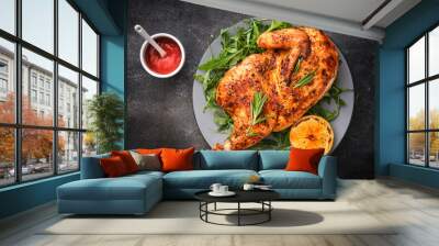 Half roasted chicken Piri Piri served with lemon and sauce . Grilled poultry Wall mural