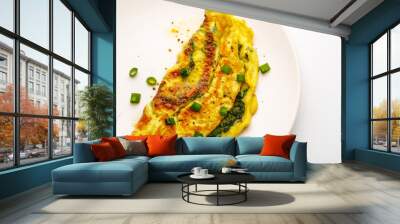 Omelet with spinach, green onions and cherry tomato on a white plate. Wall mural