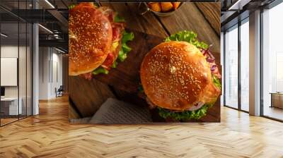 Two Delicious homemade hamburgers on wooden table.Top view Wall mural