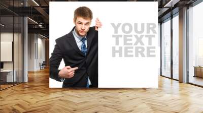 Young businessman holding a whiteboard. Concept - a demonstratio Wall mural