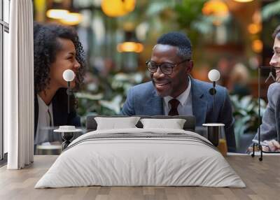 Diverse business professionals having a meeting in a cafe. Wall mural