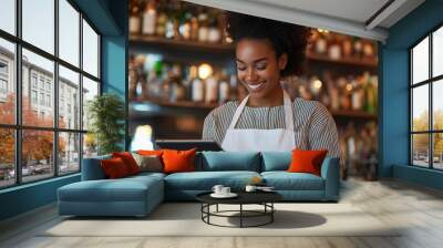 Happy waitress using a digital tablet to take orders or manage tables while working in a vibrant bar setting, showcasing modern technology in hospitality and efficient customer ser Wall mural