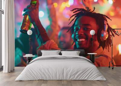 The African American man with dreads and headphones is in the middle of a lively club, raising his bottle of beer high with a big smile on his face. The club background is filled w Wall mural