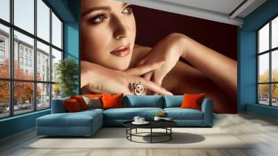 Portrait of beautiful young woman with makeup in luxury jewelry Wall mural