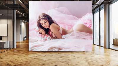 Sexy beautiful girl in pink underclothes Wall mural