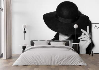 high fashion portrait of elegant woman in black and white hat and dress. Studio shot Wall mural