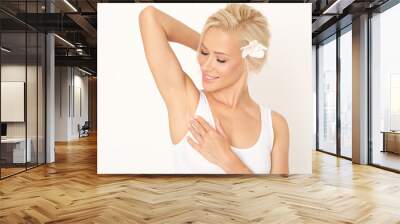 Close up of female armpit isolated on pink background. Smooth and fresh skin after shaving. Wall mural