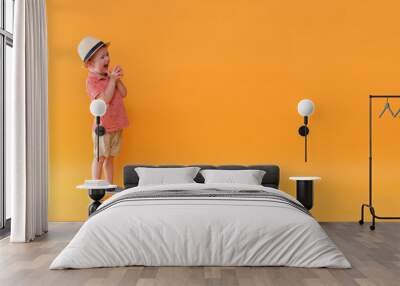 Super happy and stylish baby boy is ready of holiday. Summer outfit. Wall mural