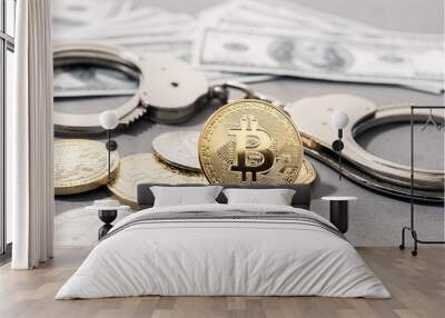 Crypto crime fraud concept. Bitcoin and crypto coins, handcuffs and US dollar banknotes Wall mural