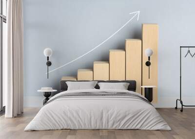 Wooden block financial bar chart graph with upward trend line drawn on background. Growing business concept Wall mural