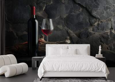 A bottle of red wine and a wine glass are on a table Wall mural