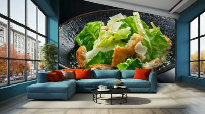 A bowl of salad with lettuce, bread crumbs, and cheese Wall mural