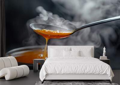 A spoon is scooping a thick, red soup from a bowl Wall mural