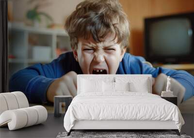 child throwing a tantrum because he doesn't want to stop playing video games. Wall mural