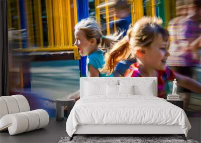 Two girls running in a park with other children Wall mural