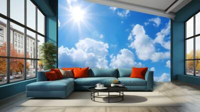 Clear blue skies with fluffy white clouds. Summer sunlight creates a beautiful and bright atmosphere. The wind gently moves the clouds, creating a scenic pattern in the sky. A perfect sunny day Wall mural