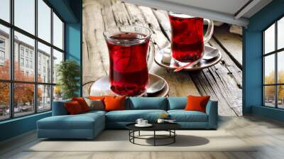 Morning red tea with smartphone laying near by the cup Wall mural