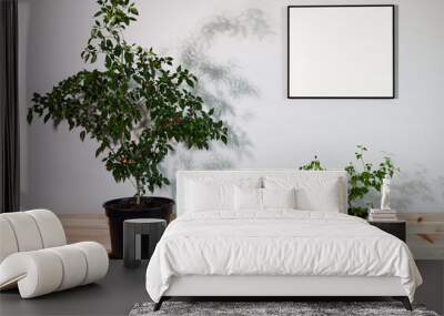 Mockup black frame interior above wooden shelf with chili plants. Wall mural