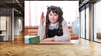 girl student at school sitting at a desk Wall mural