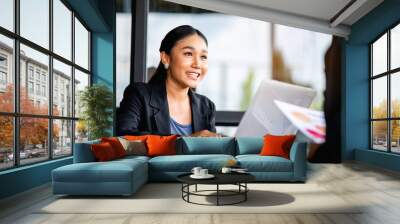 young business woman working intently and have a bright smile Meeting of the work plan financial planner finance staff happy work Financial and investment planner Wall mural