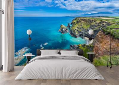 View of the South Devon coast, England, in the summer with clear waters, blue sky and grass. Wall mural