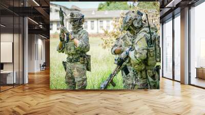 United States Army ranger during the military operation. Professional marine soldiers training with weapon on a military range. Wall mural