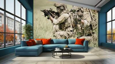 United States Army ranger during the military operation. Professional marine soldiers training with weapon on a military range. Wall mural