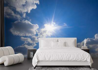 blue sky with clouds and sun reflection.The sun shines bright in the daytime in summer Wall mural