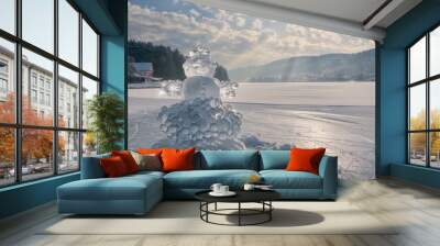 Charming Snowman on a Frozen Lake Beneath Overcast and Cloudy, Gloomy Skies Above Wall mural