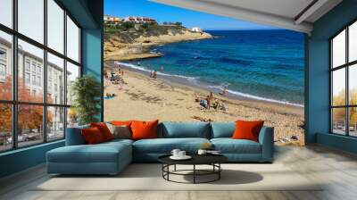 People sunbathing on the Beach of Balai at Porto Torres on Sardinia in Italy Wall mural