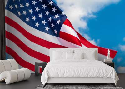 American flag waving in the wind against blue sky Wall mural