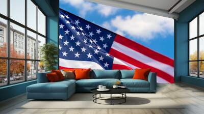 American flag waving in the wind against blue sky Wall mural