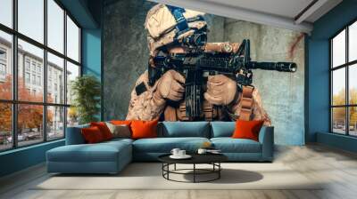 American private military contractor shooting a rifle. Studio shot Wall mural