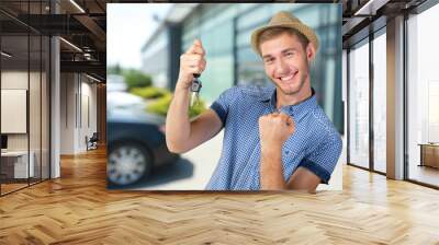 Attractive teenage boy holding car keys Wall mural