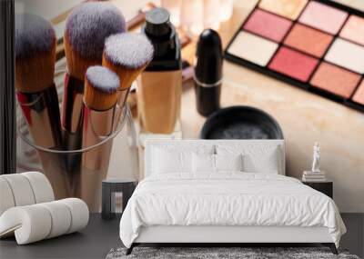 Decorative cosmetics and tools on dressing table in makeup room, close up Wall mural