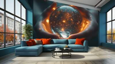 Glowing crystal ball held in hands under a dark sky with sparkling stars and cosmic elements at night Wall mural