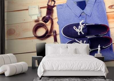 Men's casual clothes on wooden background Wall mural