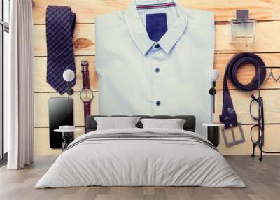 Men's casual clothes on wooden background Wall mural