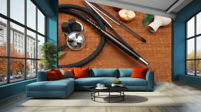 Parts of hookah and fruits on wooden background Wall mural