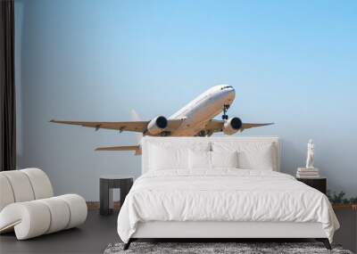 Passenger plane takes off from runway in airport Wall mural