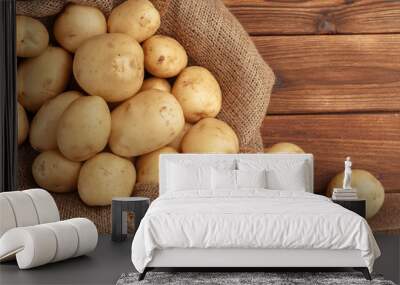 Pile of potatoes lying on wooden boards Wall mural