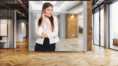 Portrait of confident young woman standing Wall mural