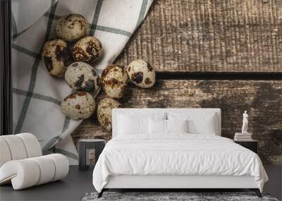 Quail eggs on a wooden table Wall mural