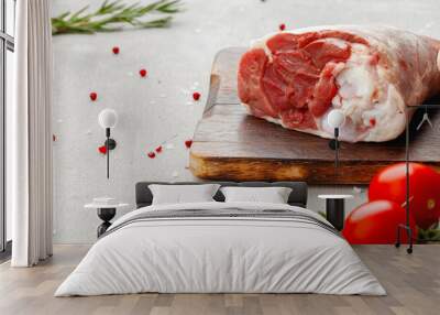 Raw lamb shanks on wooden board close up Wall mural