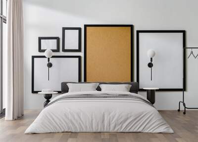 Set of black frames on white wall with copy space Wall mural